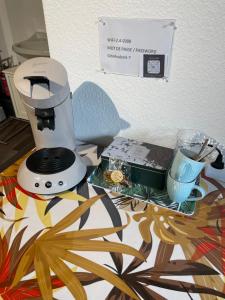 a sewing machine sitting on top of a table at Gîte d'Avalon Chambre 7 in Dinant