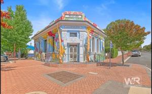 a painting of a building on a street at Bank-sia accommodation in Mount Barker