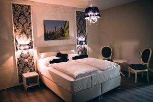Postel nebo postele na pokoji v ubytování Hotel Bakarni Lonac