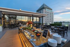 a buffet on the roof of a building at Kameo Grand Hotel & Serviced Apartment, Rayong in Rayong