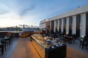 a restaurant on the roof of a building at Kameo Grand Hotel & Serviced Apartment, Rayong in Rayong +37 photos