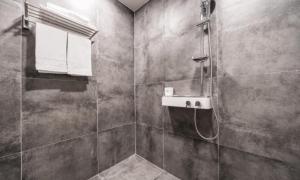 a bathroom with a shower and a sink at Pohang Hotel La Terrace in Pohang +36 photos