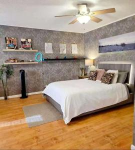 a bedroom with a bed and a ceiling fan at Wallace getaway in Delta
