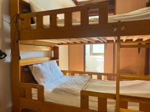 a couple of bunk beds in a room at Basic Simple Family 3 Bedroom for 4 Person in Nathon Bay +41 photos