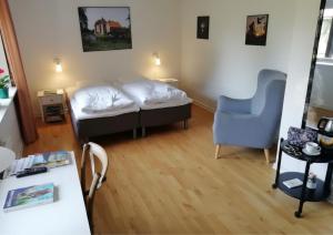 a bedroom with a bed and a desk and a chair at Gram Slot in Gram