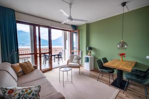 a living room with a couch and a table at Lake View Apartments in Acquaseria