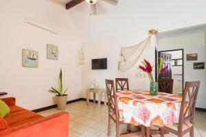 a dining room with a table and chairs at Playa Potrero Apartments in Potrero