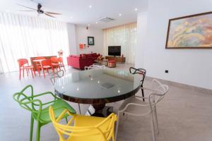 a living room with a table and chairs at Villa Flamingo Hải Tiến in Thanh Hóa