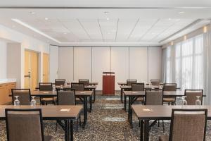 a conference room with tables and chairs and a podium at Hampton Inn & Suites by Hilton Langley-Surrey in Surrey +41 photos