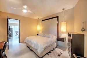 a bedroom with a bed and a dresser and a desk at Departamento Taheima Nuevo Vallarta in Nuevo Vallarta