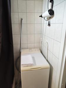 a white refrigerator with a light on top of it at Kaksio lähellä keskustaa in Iisalmi