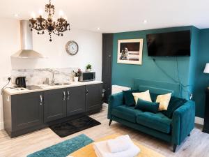 a living room with a couch and a sink at Market View 1 in Hexham +20 photos