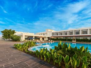 an image of a resort with a swimming pool at Empire By Zuper in Bhopal