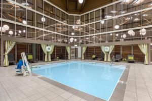 a large swimming pool in a large building at Radisson Hotel St Louis Downtown Convention Center in Saint Louis