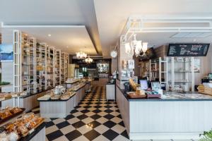a bakery with a checkered floor at Kameo Grand Hotel & Serviced Apartment, Rayong in Rayong