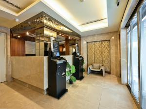 a lobby of a building with a waiting area at Guide Hotel Taipei NTU in Taipei