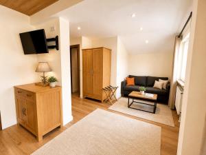 a living room with a couch and a table at Chalet Bodenschatz in Vandans
