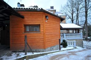 a wooden cabin with a window on a house at Apartament U Jacka in Rabka-Zdrój