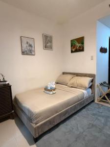 a bedroom with a large bed in a room at Yugen Studio in Davao City +9 photos