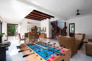 a living room with a foos ball at Private Pool 4BR Villa with Sea View Sleeps 8 in Mae Pim