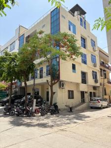 a large building with motorcycles parked in front of it at New Hotel Blue Moon in Jaipur