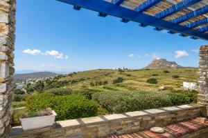 a view from the window of a house at Tzados Sunny Villa in Kariá