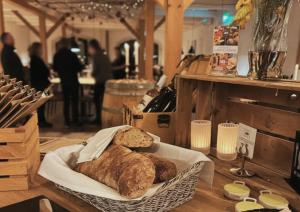 a basket with two loaves of bread on a table at Gram Slot in Gram