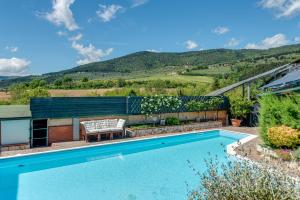 a swimming pool with a mountain in the background at Guest House Fantaccini con Piscina in Pelago