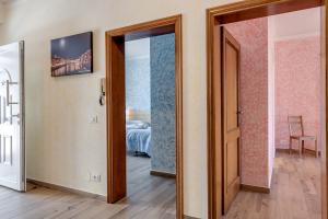 a room with a door open to a bedroom at Guest House Fantaccini con Piscina in Pelago