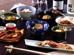 a table with bowls of food on a table at Nagataki in Nakatsugawa +111 photos