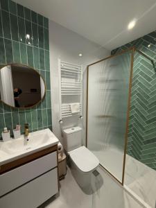 a bathroom with a toilet and a shower and a sink at Savanna Guest House in Dedoplis Tskaro +48 photos