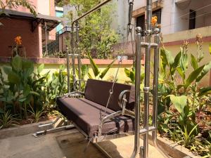 a swing in a garden with plants at My second home at Nashik in Nashik