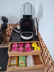 a coffee maker sitting on top of a coffee machine at Le cocon de Suze in Suze-la-Rousse