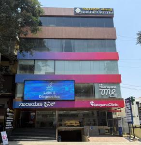 a building with a sign on the side of it at Golden Suites in Bangalore