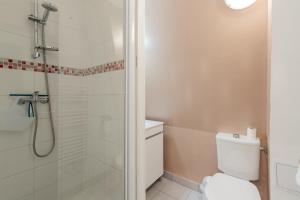 a bathroom with a shower and a toilet at Gîte Escale En Baie De Somme in Saint-Blimont +13 photos