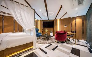 a bedroom with a bed and a desk and a chair at Hotel the Castle Jamsil Sports Complex in Seoul