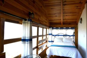 Postel nebo postele na pokoji v ubytování Cabañas el Chalet