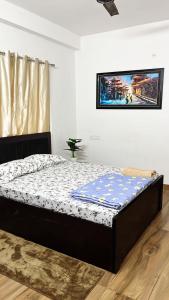 a bedroom with a bed in a room at PnH Stays in Siliguri