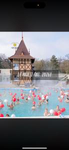 a group of people swimming in a swimming pool at Pensiunea Sun Victor in Baile Felix