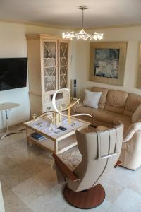 a living room with a couch and a coffee table at Casa Lucia in Palm-Mar