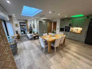 a kitchen and dining room with a table and chairs at Havendale in Chesterfield