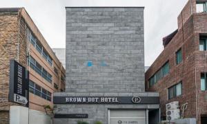 a brick building with a sign in front of it at BrownDot Hotel Bong-Duk in Daegu