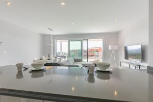 a living room with a table with bowls on it at Doña Julia Sea View Marvel in Casares