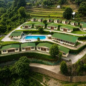 an aerial view of a resort with a swimming pool at HR The nature resort in Birbhaddar