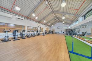 a gym with a bowling alley and tread machines at Marine Court Three Bedroom Second-floor Apartment 35 in Littlehampton