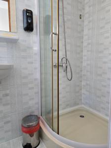 a shower with a glass door in a bathroom at Casa Panorama Sovata in Sovata +46 photos