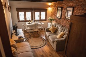 a living room with a couch and a table at El Mirador in Cudillero