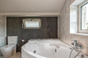 A bathroom at Legrena Beach Villa