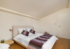 A bed or beds in a room at Legrena Beach Villa