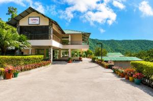 a building with flowers in front of it at Sterling Corbett in Marchula +59 photos